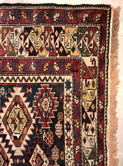 Colorful geometric tribal looking Russian Caucasian Shirvan rug