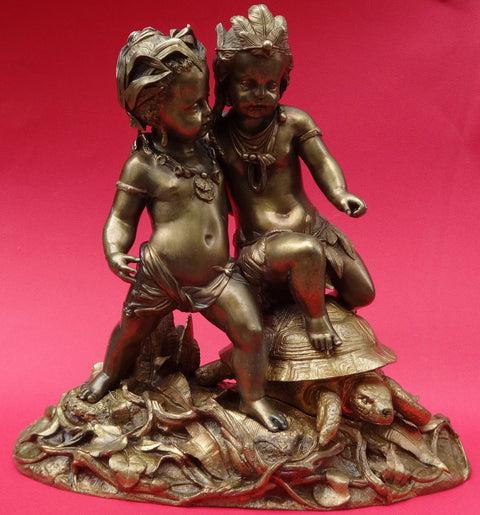 Africa and America Statuette cherubs and a turtle