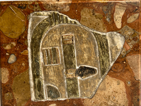 AN EGYPTIAN PAINTED LIMESTONE RELIEF FRAGMENT