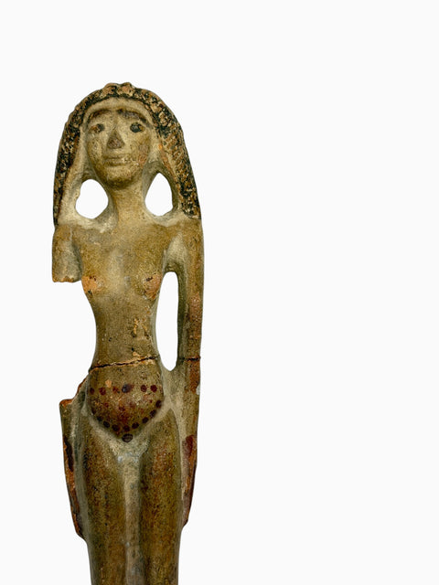 AN EGYPTIAN TERRACOTTA FEMALE FIGURE