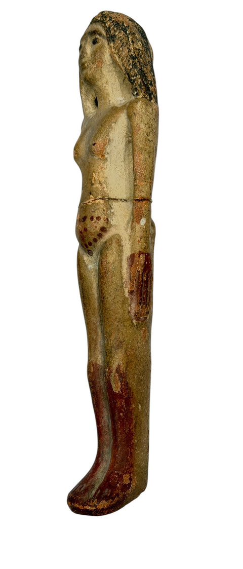 AN EGYPTIAN TERRACOTTA FEMALE FIGURE
