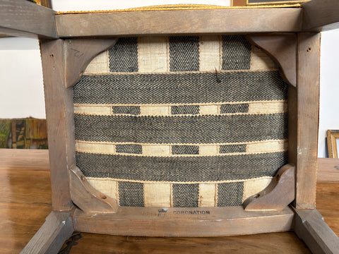 Wooden chair with a patterned cushion on a blurred background